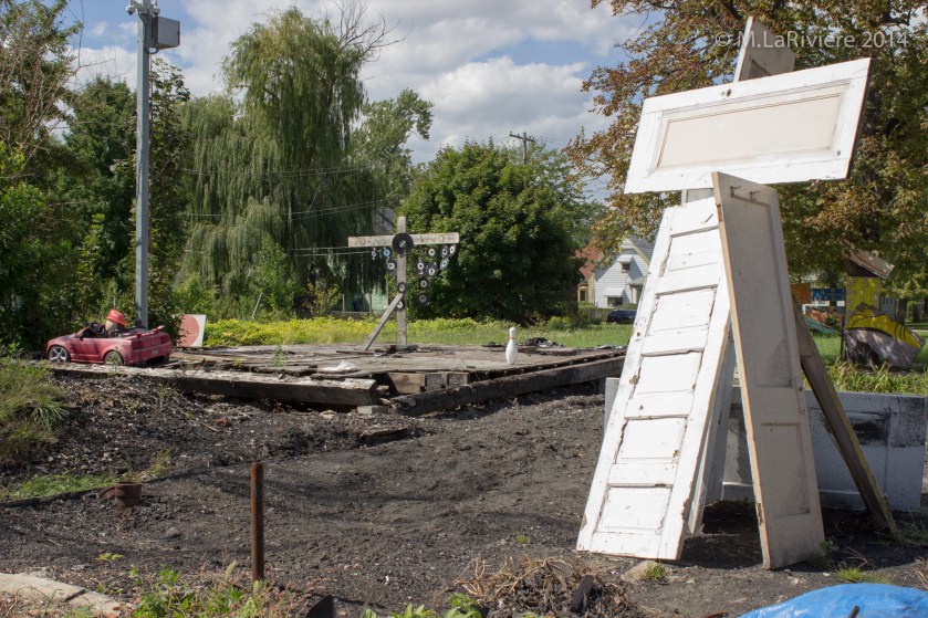 I'm guessing that the house foundation where the cross is is where the art house covered in vinyl albums once stood - another casualty of arson